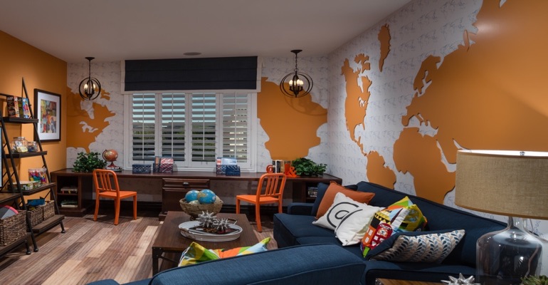 Plantation shutters are an ideal window treatment for a learning center. Family room with wall map and plantation shutters